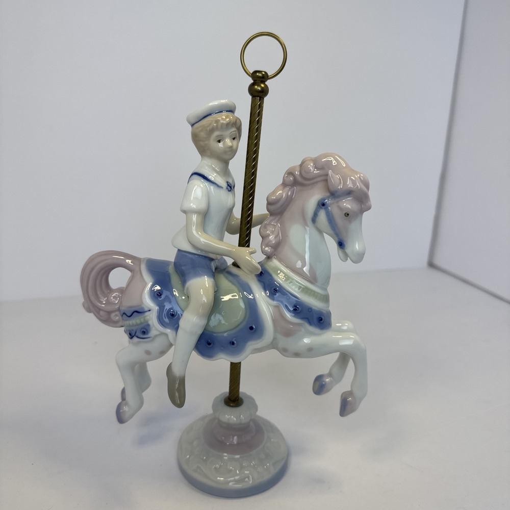 LLADRO STYLE~Paul Sebastian, sailor child on carousel horse figurine dated 1990